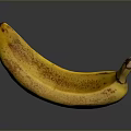 Ripe Yellow Banana With Brown Spots On Dark Reflective Surface