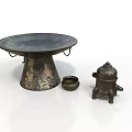 Intricate Metal Sculpture Carving Featuring Decorative Base And Ornate Tripod Lid Artwork