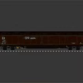 Red Train Carriage Parked On Railway Tracks With White Text And Numbers Against Dark Background