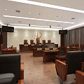 Courtroom Interior with Judge's Bench Audience Seats Large Screens Wooden Furniture and National Emblem