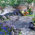 Serene Courtyard Garden With Green Trees Blue Flowers Rocks Table Chairs And Misty Atmosphere