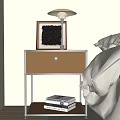 Modern Nightstand with Metal Frame Brown Drawer Table Lamp Picture Frame Books and Decor