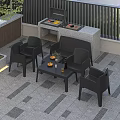 Black Outdoor Lounge Chairs With Side Table And Fruit On Patio Gray Tile Floor