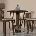 Modern Round Dining Table Set With Patterned Top Four Wooden Leg Chairs And White Bowls