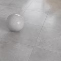Modern Gray Floor Tiles With Textured Surface And White Sphere On The Ground