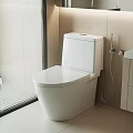 Sleek Modern White Toilet in Contemporary Bathroom with Tile Walls and Glass Shower