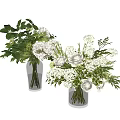 White Roses and Hydrangeas in Glass Vases with Green Leaves and Branches