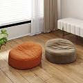 Two Round Orange And Gray Bean Bag Chairs On Wooden Floor In Living Room