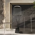Modern Minimalist Metal Leisure Chair With Silver Frame And Mesh Design In Natural Light
