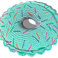 Knitted Donut Shaped Light Green Pillow With Colorful Stripes And Soft Texture
