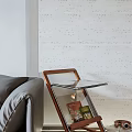 Wooden Frame Glass Top Side Table With Magazine Rack Next To Sofa