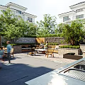 Modern Garden Landscape With Villas Green Plants Outdoor Seating Stone Pavement And Courtyard Area