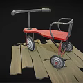 Children's Red Toddler Walker With Four Wheels On Wooden Planks