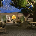 Modern House Exterior Night View With Trees Wall Gate Pillars And Balcony
