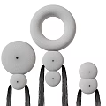 Modern Black Round Wall Decor With Stacked Spheres And Hanging Tassels Design