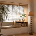 Cozy Bay Window with Blinds Cushion Storage Cabinets and Plants Near Floor Lamp