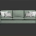 Modern Teal Upholstered Sofa With Geometric Patterned Pillows And Three Seats