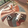 Colorful Abstract Pattern Round Area Rug on Wooden Floor with White Puppy Toy and Magazine