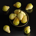 Fresh Ripe Pears Placed in Dark Bowl and Scattered Around on Black Background