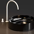 Round Black And White Washbasins With Black Faucet And White Accessories