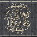 Neon Lighting Combination with Give Thanks Lettering Leaf Decorations and Hearts on Dark Stone Wall
