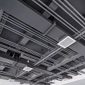 Industrial Ceiling Structure With Exposed Metal Beams Pipes And Ventilation Grilles