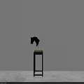 Black Plate Decoration Display On Small Black Table With Golden Base Against White Background Wall