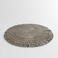 Neutral Toned Round Rug with Textured Ruffled Edges and Concentric Patterns