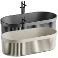 Two Modern Oval Bathtubs With Ribbed Design And Black Faucets 3d model