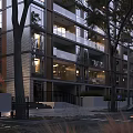 Modern Multi Storey Residential Building With Glass Facade Balconies Lit Windows And Trees Around