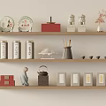 Traditional Tea Set Display With Ceramic Canisters Teapot Cups And Figurines On Wooden Shelves
