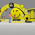Smiley Face Themed Playground With Interactive Elements People Playing And Yellow Decorations