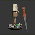 Candle Holder With Melted Candle Colored Gems Skull And Orange Handle Knife