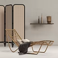 Wicker Lounge Chair With Pillows And Blanket Near Rattan Screen And Wall Shelf