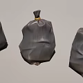 Three Gray Plastic Bags With Tied Tops For Home Waste Storage