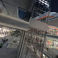 Modern Commercial Street Night View With Tall Buildings Illuminated Shops Green Plants And Lighting