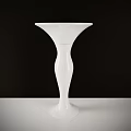 Elegant White Ceramic Vase Standing On White Tabletop With Black Background