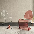 Modern Transparent And Red Leisure Chairs In Stylish Interior With Textured Wall And Window