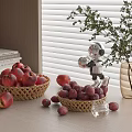 Fresh Red Apples in Woven Baskets Scattered on Table with Robot Model Vase and Books