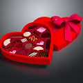 Heart Shaped Red Gift Box Filled With Assorted Chocolates And Pink Bow
