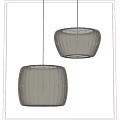 Two Modern Beige Pleated Shade Pendant Lights Hanging In Interior Design