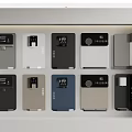 Various Colored Electronic Devices With Digital Displays In Display Case