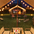 Outdoor Night Garden Landscape with Tents String Lights Dining Chairs Bonfire and Trees on Grass