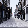 Traditional Commercial Street Featuring Vintage Shop Facades And Cobblestone Walkway