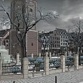Charming Commercial Street With Canal Boat Traditional Buildings Trees And Benches
