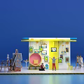 Colorful Exhibition Booth with Blue White Design and Hanging Paintings on Easels