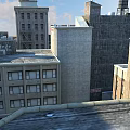 Old Industrial Style Residential Buildings With Brick Concrete Exteriors And Roof Equipment Under Blue Sky