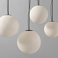 Four White Spherical Pendant Lights with Black Wires Against Grey Wall Modern Design