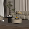 Round White Coffee Table In Modern Living Room With Bowl Of Lemons And Side Table