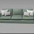 Modern Teal Upholstered Sofa With Geometric Patterned Pillows And Three Seats